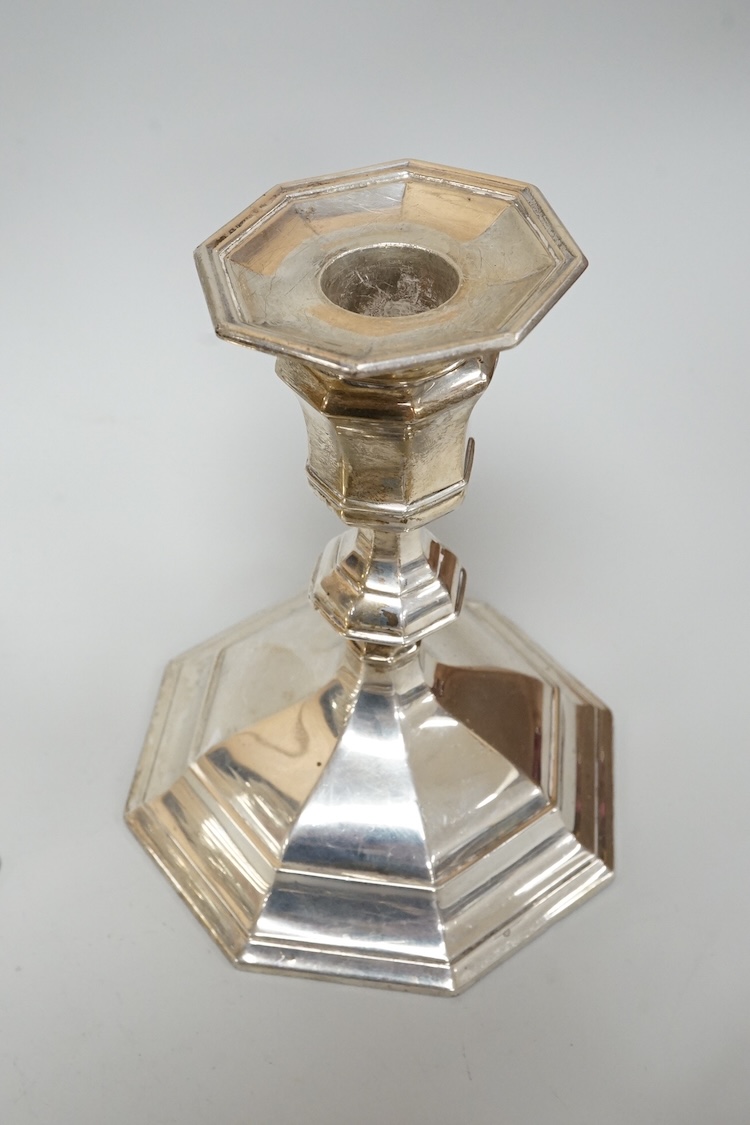A pair of Edwardian silver mounted octagonal dwarf candlesticks by William Hutton & Sons, London, 1905, 12.7cm, weighted, one lacking sconce, together with a silver pin tray a continental sugar bowl with glass liner and